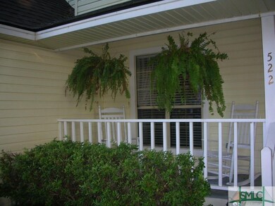 Low Country Porch with rocking chairs and ferns. W