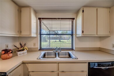 Kitchen features large pass through window with a counter on the other side (inside screened lanai) for easy entertaining.