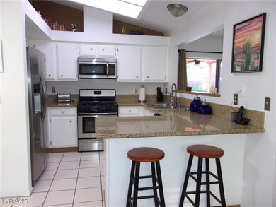 Kitchen with a sink, appliances with stainless ste