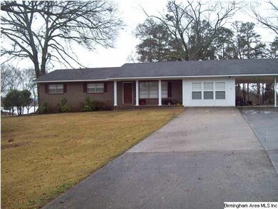 Facing front of home featuring double wide drive a