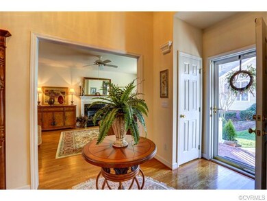 Open hardwood 2-story Foyer with mouldings and coa