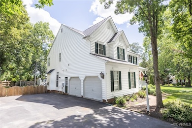 Two bay side entry garage with an extra wide drive