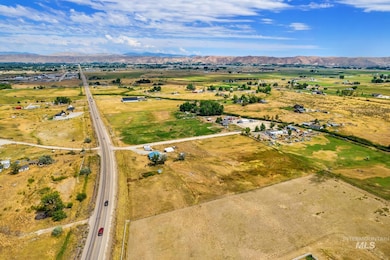 Aerial view of sparsely populated area featuring a mountainous background