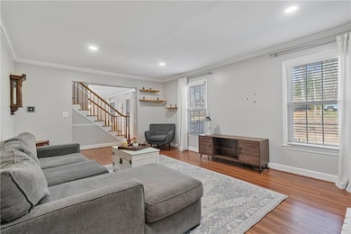 Living area with recessed lighting, wood finished 