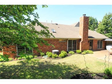 Fenced Back Yard. Flower Beds With Perennials and 