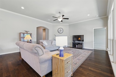 Living area with baseboards, recessed lighting, ce