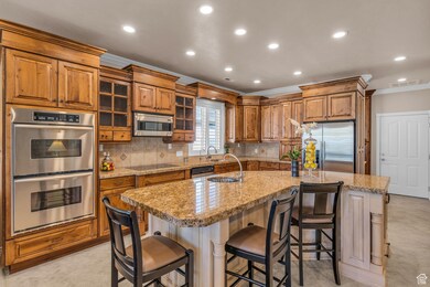 9' ceilings, custom cabinetry, granite countertops, 2 sinks, and radiant heating in floor