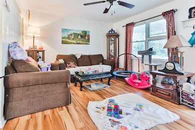 Living room with hardwood / wood-style floors and 