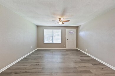 This fourplex features a large living area at the