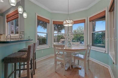 Kitchen with bar seating, pendant lights, eat in k