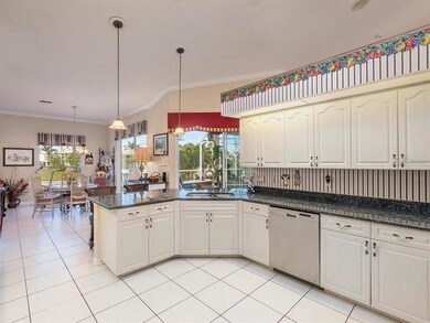 Kitchen has an over abundance of cabinetry and gra
