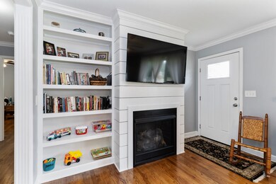New vented gas fireplace and built ins greet you from the front door entry. 