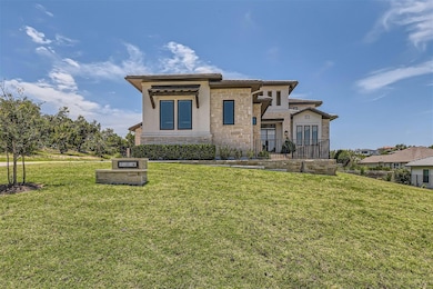 View of front of home with stucco siding, stone s