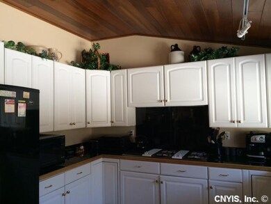 Kitchen. Clean white cabinets create a stark contr