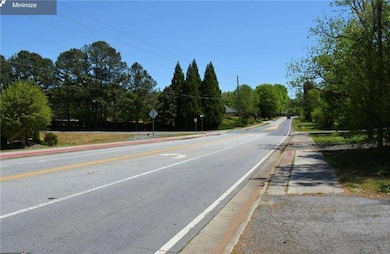 View of asphalt street with traffic signs