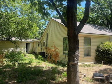 View of side of property with central AC