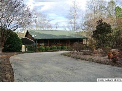WELL LANDSCAPED YARD WITH CIRCULAR DRIVE