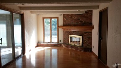 Family/hearth room is very cozy with natural hardw