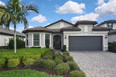 Mediterranean / spanish-style home featuring a gar