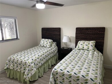 Bedroom featuring light wood-type flooring and cei