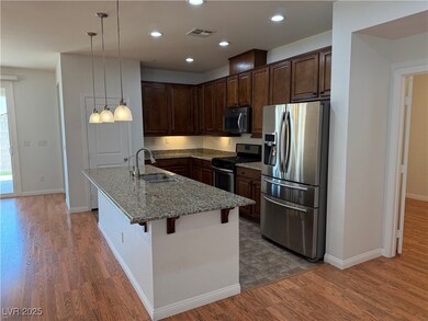 Kitchen featuring stainless steel appliances, wood
