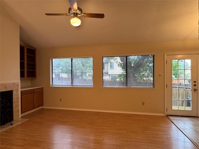 Unfurnished living room with lofted ceiling, ligh