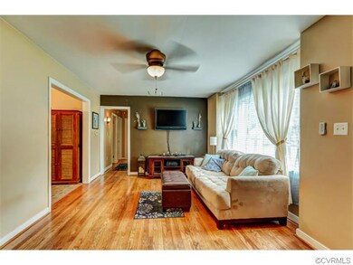 Alternate view of the family room with ceiling fan