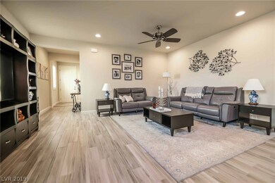Stunning great room plan with shutters, ceiling fa