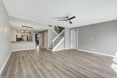 Unfurnished living room with light hardwood / wood