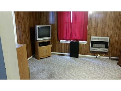 Exterior Front. Apt B Living Room