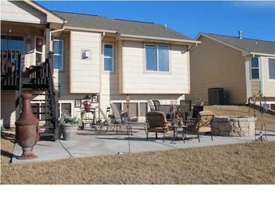 Large concrete patio off the covered deck offers g
