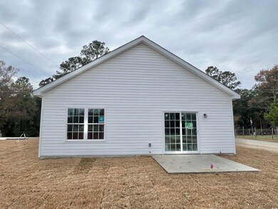 View of property exterior with a patio area and a 