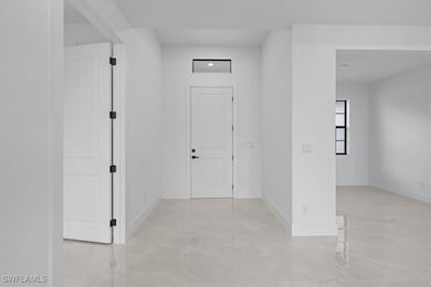 Foyer with baseboards