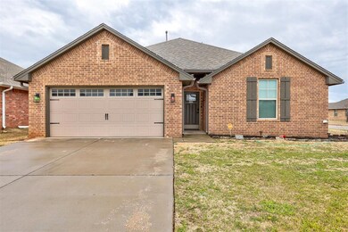 View of front facade featuring a garage and a fron