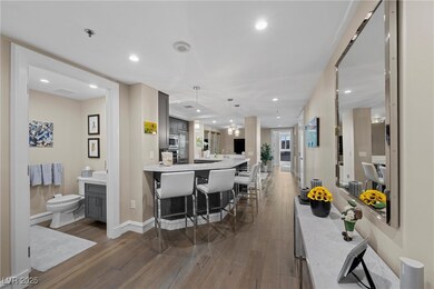 Kitchen featuring dark wood finished floors, a bre
