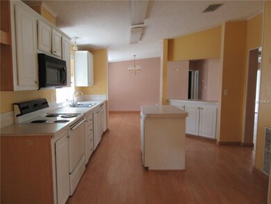 Kitchen with island and all appliances are include