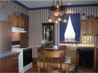 Kitchen. Corner of kitchen with sink behind the ta