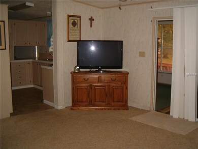 living room off kitche with sliding door to beauti