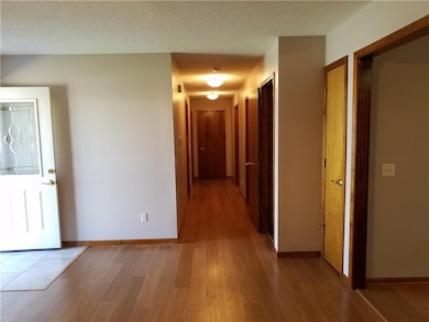Wide hallway, large linen closet at end of hall