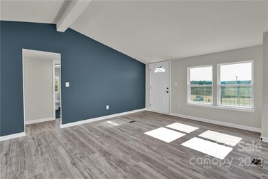 Spacious living room with beautiful vinyl plank flooring