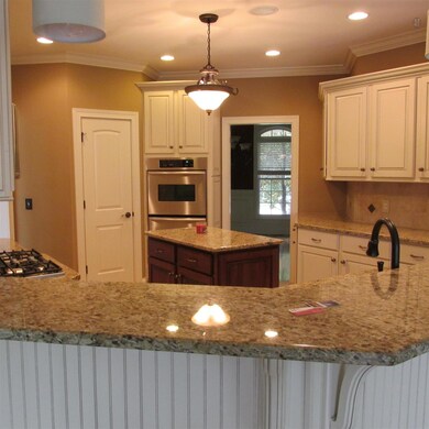 Kitchen with Granite, Tile and Stainless appliances.
