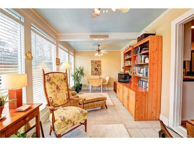 Bright Florida Room overlooks back yard.