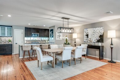 Dining space with light hardwood / wood-style floo