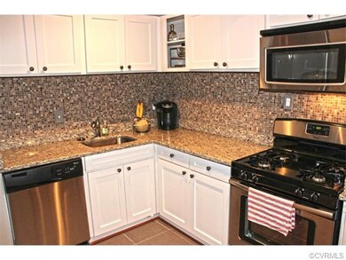 Updated kitchen with granite counters and stainless steel appliances