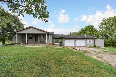 Ranch-style home with a front lawn and a porch