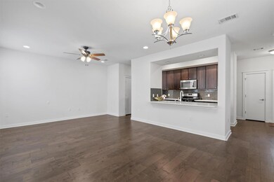 Unfurnished living room featuring a chandelier, a