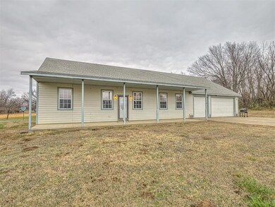 Ranch-style house with a front yard, concrete driveway, a porch, and roof with shingles
