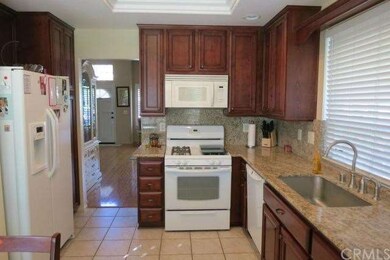 Upgraded kitchen boasts newer appliances, granite 