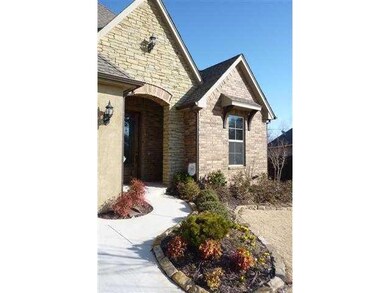 Exterior Front. Pretty rock accent gardens lead up
