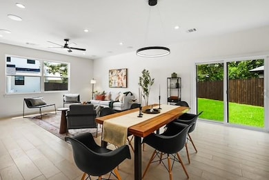 Dining room featuring recessed lighting, light wood-type flooring, healthy amount of natural light, and a ceiling fan